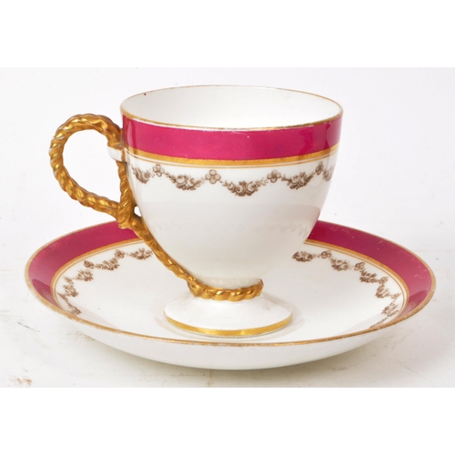 132 - Two 19th-century porcelain teacups and saucers, featuring rope twist handles to the teacups, a pink ... 