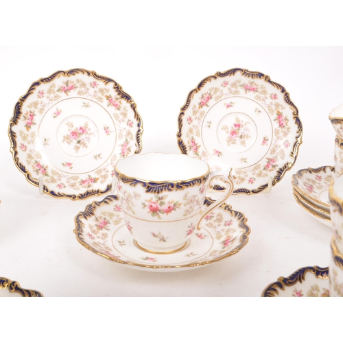 134 - Coalport - An early 20th-century porcelain eleven-person tea / coffee service set. Includes eleven c... 