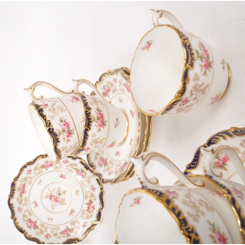 134 - Coalport - An early 20th-century porcelain eleven-person tea / coffee service set. Includes eleven c... 