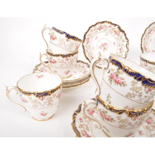 134 - Coalport - An early 20th-century porcelain eleven-person tea / coffee service set. Includes eleven c... 