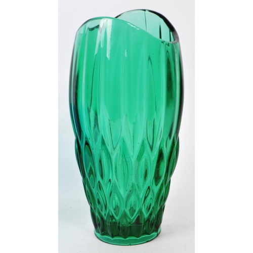 136 - Two pieces of vintage mid-20th-century glass table pieces, comprised of a green vase, and a blue han... 