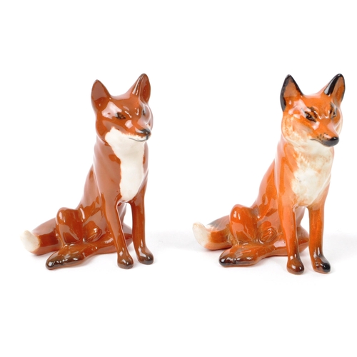 14 - Beswick - Three 20th century porcelain fox figurines, comprising of a walking adult fox, with two si... 