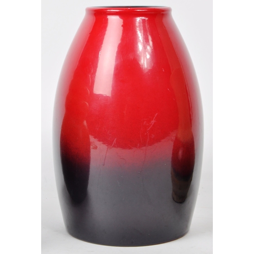 144 - A collection of three mid-century West German pottery vases, in various shapes such as a bullet vase... 