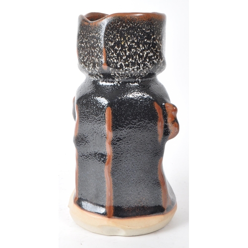 146 - A Japanese vintage mid-20th-century studio pottery vase, featuring a brown and black subtle lava gla... 