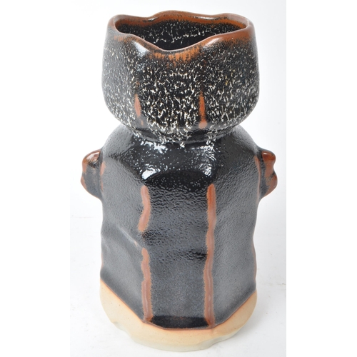 146 - A Japanese vintage mid-20th-century studio pottery vase, featuring a brown and black subtle lava gla... 