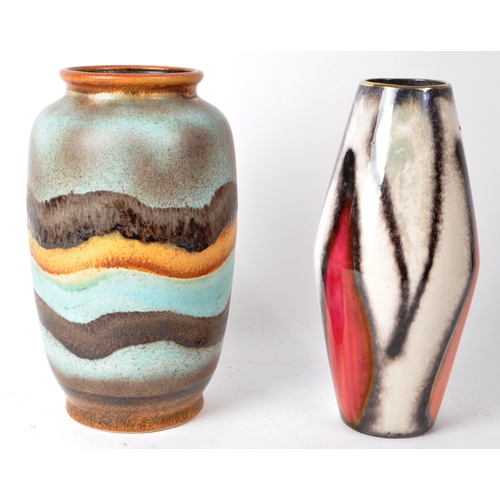 147 - A pair of West German Mid-20th-century studio pottery vases, comprised of a diamond-shaped, abstract... 