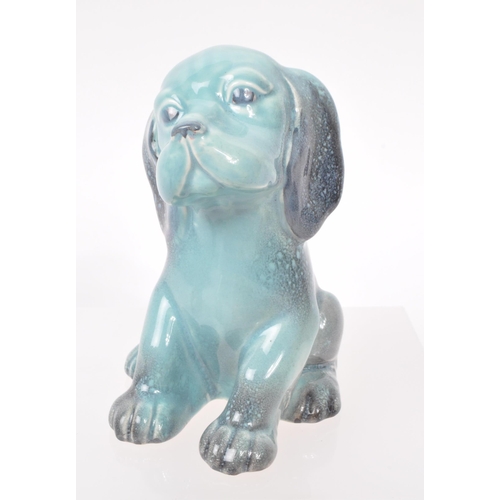 15 - Beswick - A collection of seven 20th century porcelain dog figurines, including, a Dalmatian, a Chih... 