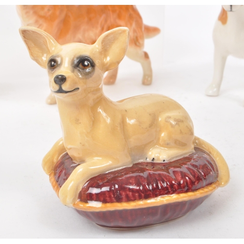 15 - Beswick - A collection of seven 20th century porcelain dog figurines, including, a Dalmatian, a Chih... 