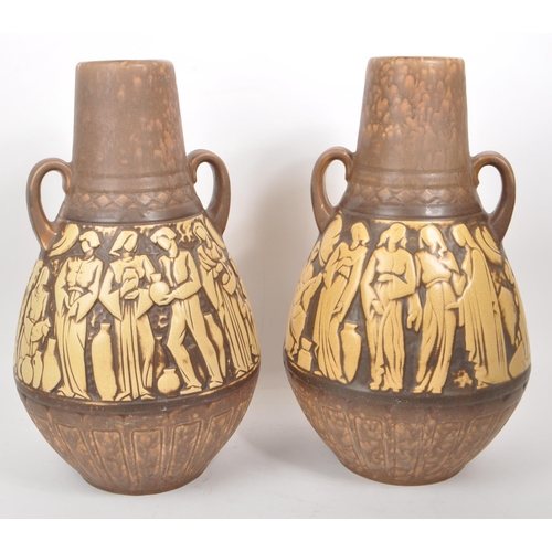 155 - A pair of mid-20th-century West German large studio pottery vases, both twin-handled with brown and ... 