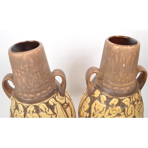 155 - A pair of mid-20th-century West German large studio pottery vases, both twin-handled with brown and ... 