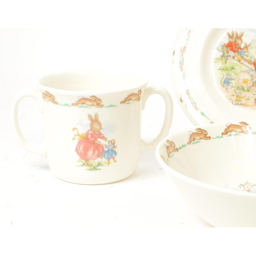 157 - Royal Doulton - Bunnykins - A collection of 20th-century bone china tableware, comprised of three pl... 