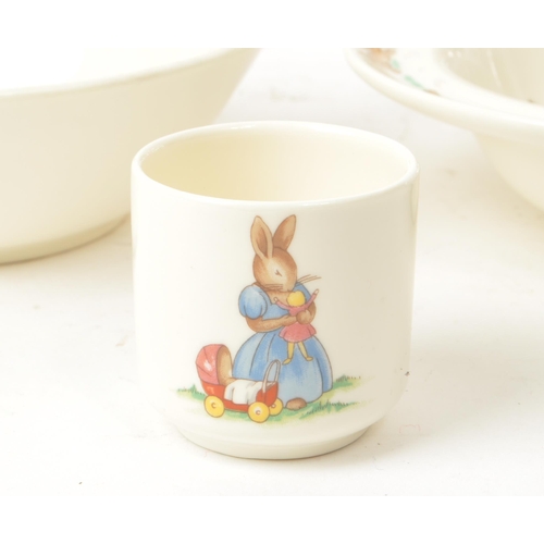 157 - Royal Doulton - Bunnykins - A collection of 20th-century bone china tableware, comprised of three pl... 