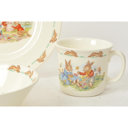 157 - Royal Doulton - Bunnykins - A collection of 20th-century bone china tableware, comprised of three pl... 