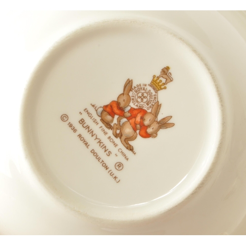 157 - Royal Doulton - Bunnykins - A collection of 20th-century bone china tableware, comprised of three pl... 