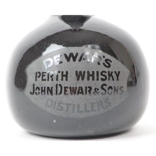 167 - An early 20th century Dewar's Perth mallet glass whiskey bottle, from John Dewar & Sons. Undersi... 