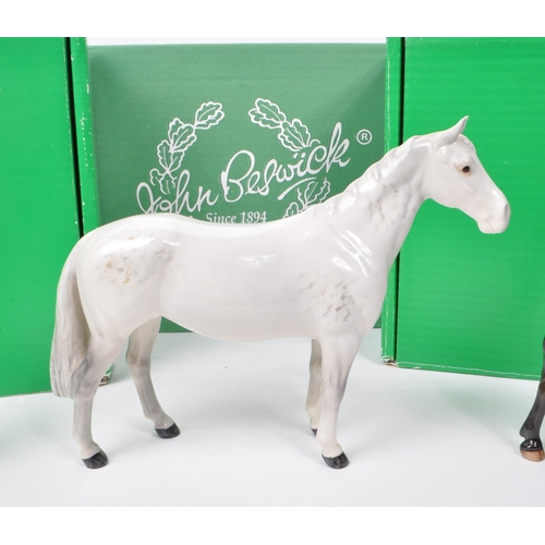 17 - Beswick - A collection of three mid century porcelain horse figurines, comprising of an Exmoor Horse... 