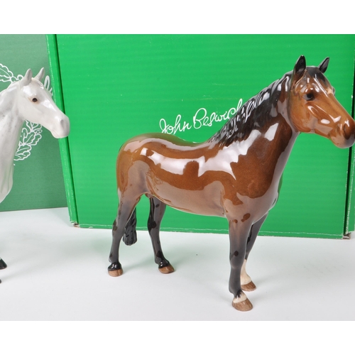 17 - Beswick - A collection of three mid century porcelain horse figurines, comprising of an Exmoor Horse... 