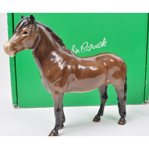 17 - Beswick - A collection of three mid century porcelain horse figurines, comprising of an Exmoor Horse... 