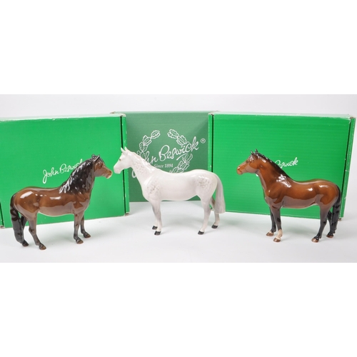 17 - Beswick - A collection of three mid century porcelain horse figurines, comprising of an Exmoor Horse... 