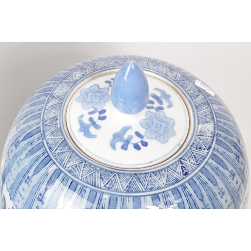 189 - 20th century Chinese large blue and white lidded vase and umbrella stand. Both featuring a floral / ... 