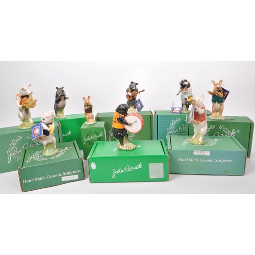 19 - Beswick - A collection of nine (full set) 1990s ceramic ''Pig Promenade' figurines, comprising of: A... 