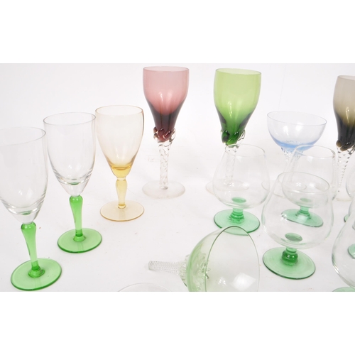 192 - A collection of 20th century vintage aperitif and brandy glasses to include examples with coloured a... 