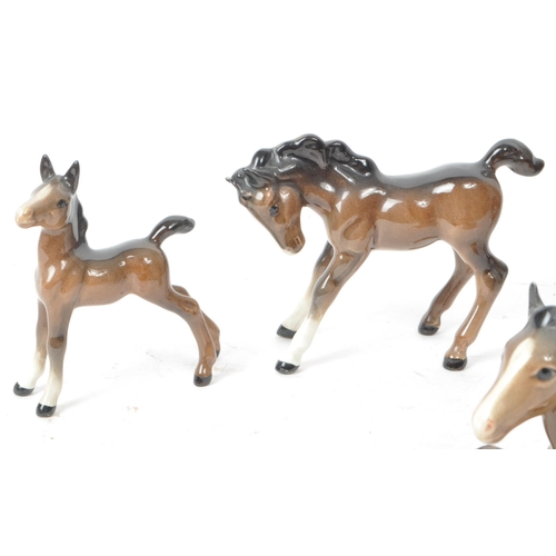 193 - Beswick - Five mid 20th century brown horse foal porcelain figurines. Beswick maker mark printed to ... 