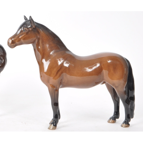 196 - Beswick - Three 20th century porcelain horse figurines, including a Dartmoor horse. All brown in col... 