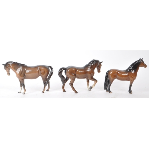 196 - Beswick - Three 20th century porcelain horse figurines, including a Dartmoor horse. All brown in col... 