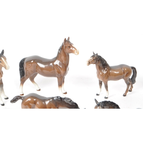 197 - Beswick - A collection of seven 20th century porcelain horse figurines, to include two shire foals, ... 