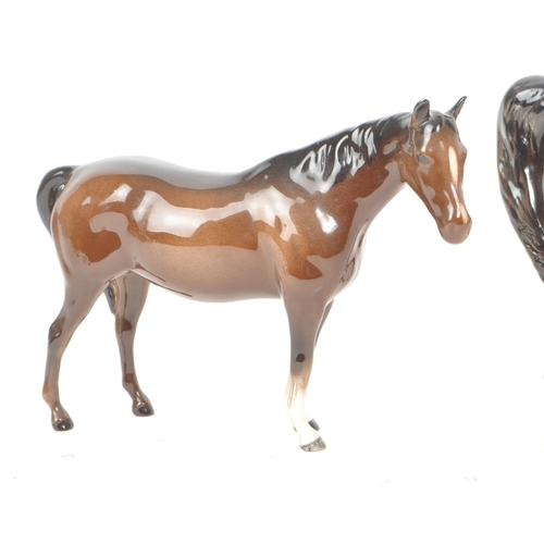 198 - Beswick - Three 20th century porcelain horse figurines, including a Prancing Arab horse, an Arab Axa... 