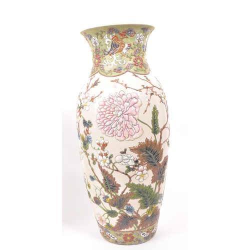 200 - Two 20th century ceramic Chinese baluster vases, with enameled relief floral patterning to the bodie... 