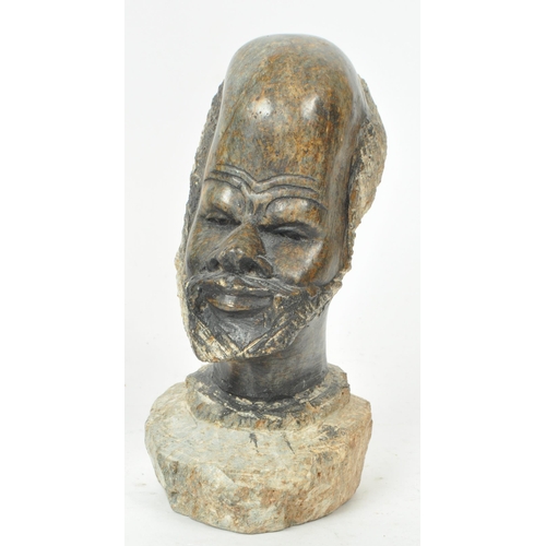 213 - A collection of five 20th-century tribal carvings and sculptures, comprising of head portraits, figu... 