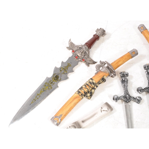 214 - A collection of eight contemporary replica dragon-themed swords, to include, five katanas, two dagge... 