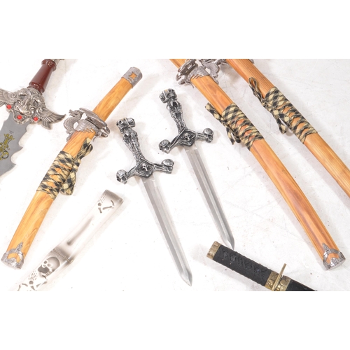 214 - A collection of eight contemporary replica dragon-themed swords, to include, five katanas, two dagge... 