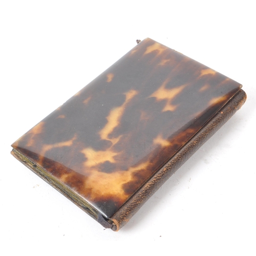 216 - A vintage mid 20th century tortoiseshell and gold plate notebook. The notebook encased in tortoisesh... 