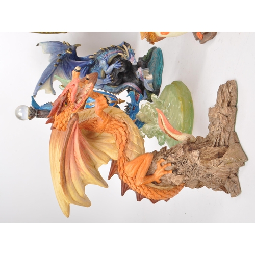 223 - A collection of nine contemporary resin / plastic dragon figures, from makers such as Veronese, Ench... 