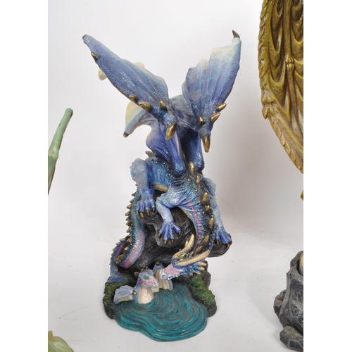 223 - A collection of nine contemporary resin / plastic dragon figures, from makers such as Veronese, Ench... 