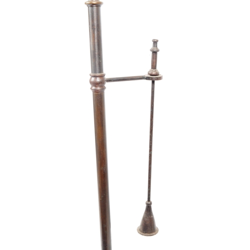 230 - An early 20th century brass and glass pillar candle holder. Brass central support column with finial... 