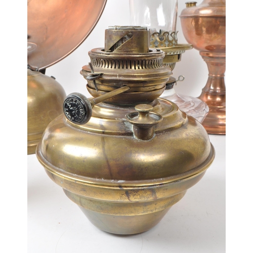 231 - A collection of Victorian 19th century and later oil lamps. Brass and copper construction with flute... 