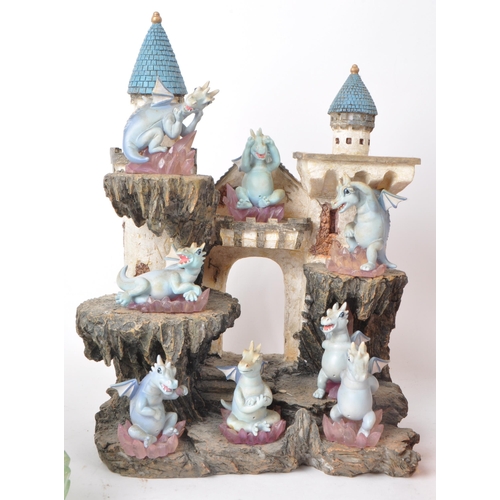 233 - The Tudor Mint - Land of The Dragons - Three 2002 resin display tiered stands, each with a collectio... 