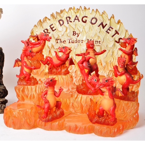 233 - The Tudor Mint - Land of The Dragons - Three 2002 resin display tiered stands, each with a collectio... 