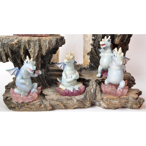 233 - The Tudor Mint - Land of The Dragons - Three 2002 resin display tiered stands, each with a collectio... 