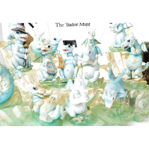 233 - The Tudor Mint - Land of The Dragons - Three 2002 resin display tiered stands, each with a collectio... 