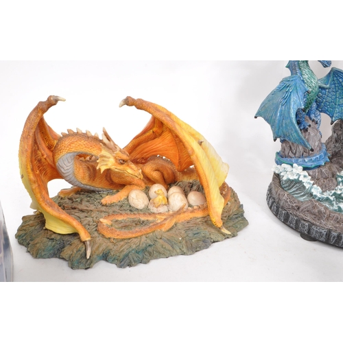 236 - A collection of assorted contemporary resin and pewter dragon figures, including makers such as The ... 