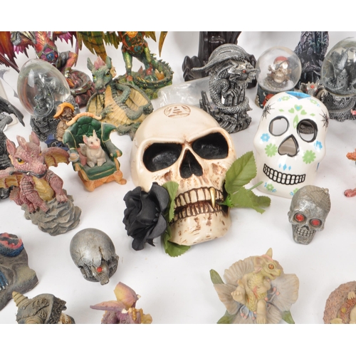 237 - A large collection of contemporary plastic and resin, dragon, and skull figures. Including, snow glo... 