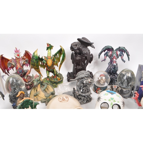 237 - A large collection of contemporary plastic and resin, dragon, and skull figures. Including, snow glo... 