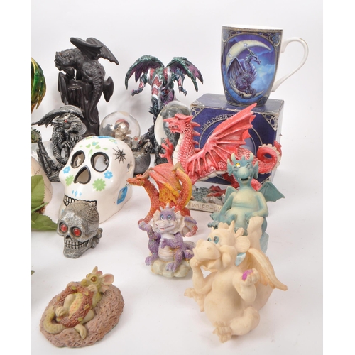 237 - A large collection of contemporary plastic and resin, dragon, and skull figures. Including, snow glo... 