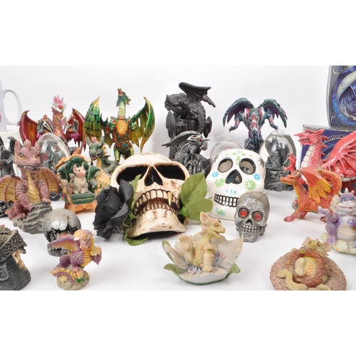 237 - A large collection of contemporary plastic and resin, dragon, and skull figures. Including, snow glo... 