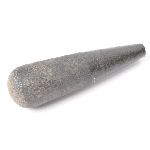 238 - A 20th-century large granite molcajete / pestle and mortar, with two stump handles and a flared base... 